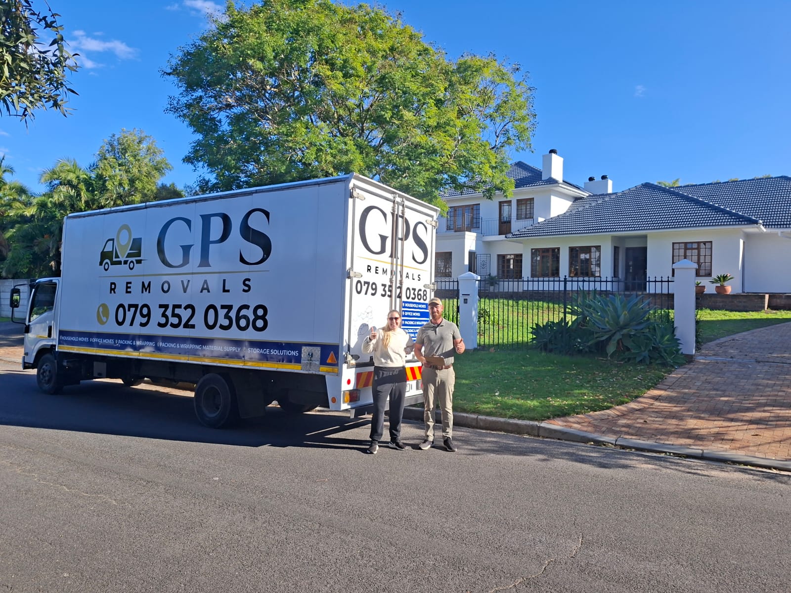 Gerhard and Sonreta beside the GPS Removals truck after a house move