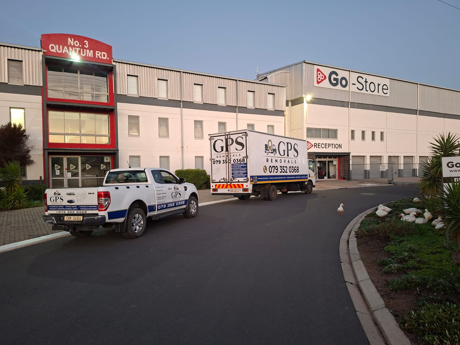 GPS Removals truck and bakkie outside the Go-Store depot on Quantum Road